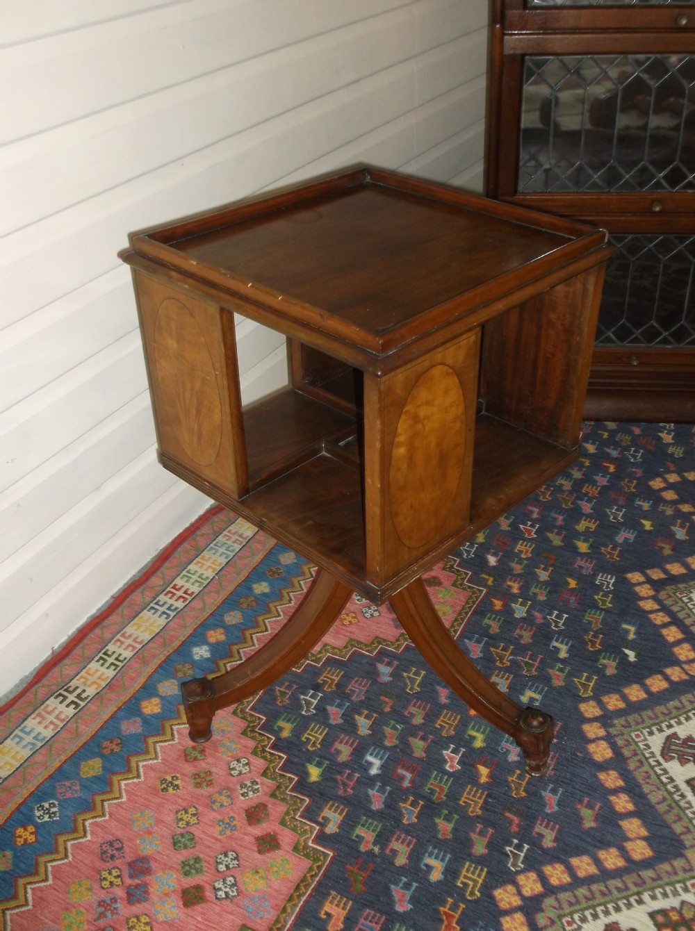Early 20th century inlaid mahogany revolving book table