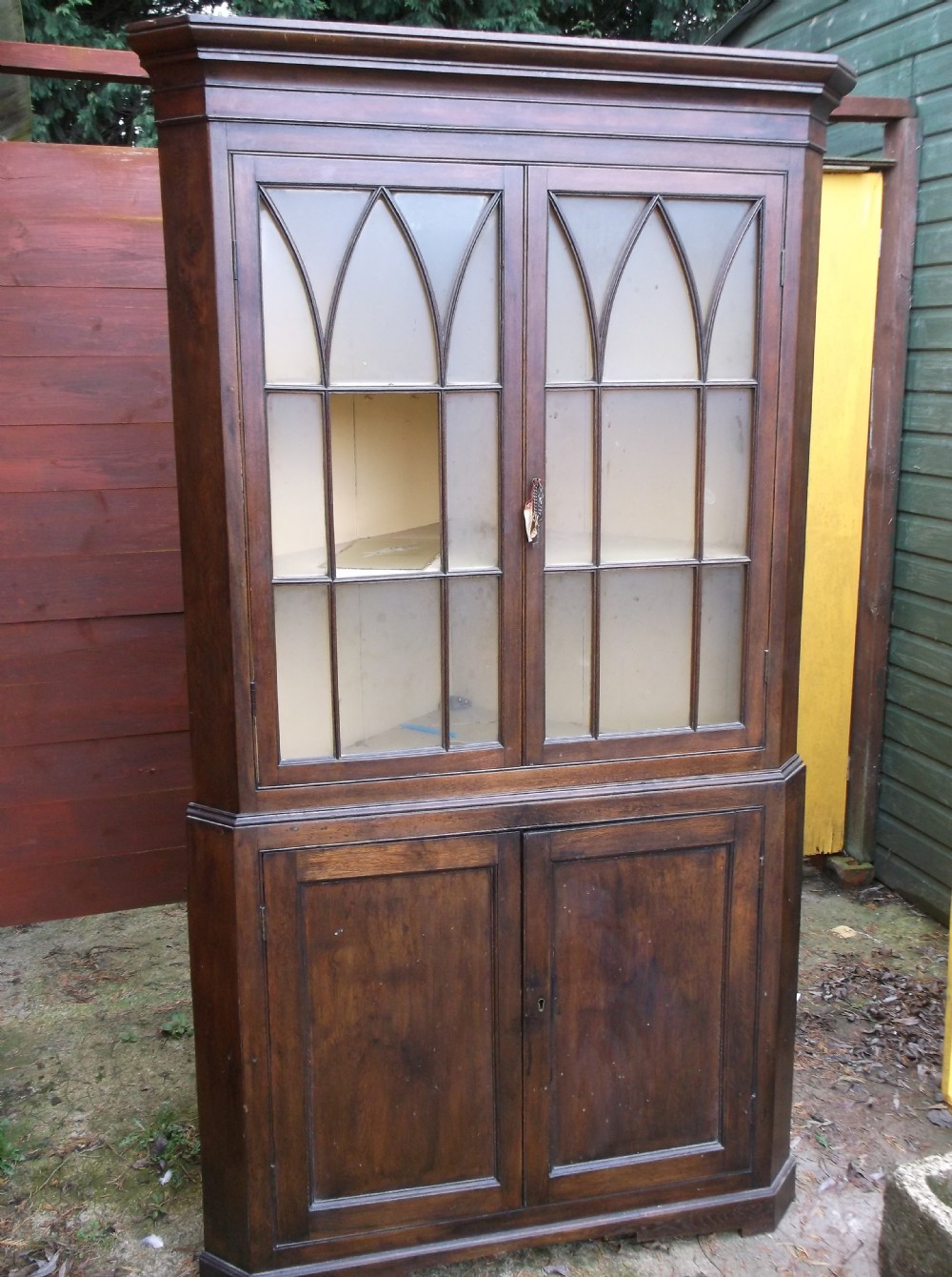 Early 19th century oak 2 part corner cupboard