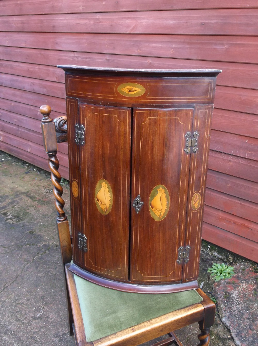 Dinky inlaid mahogany corner cupboard