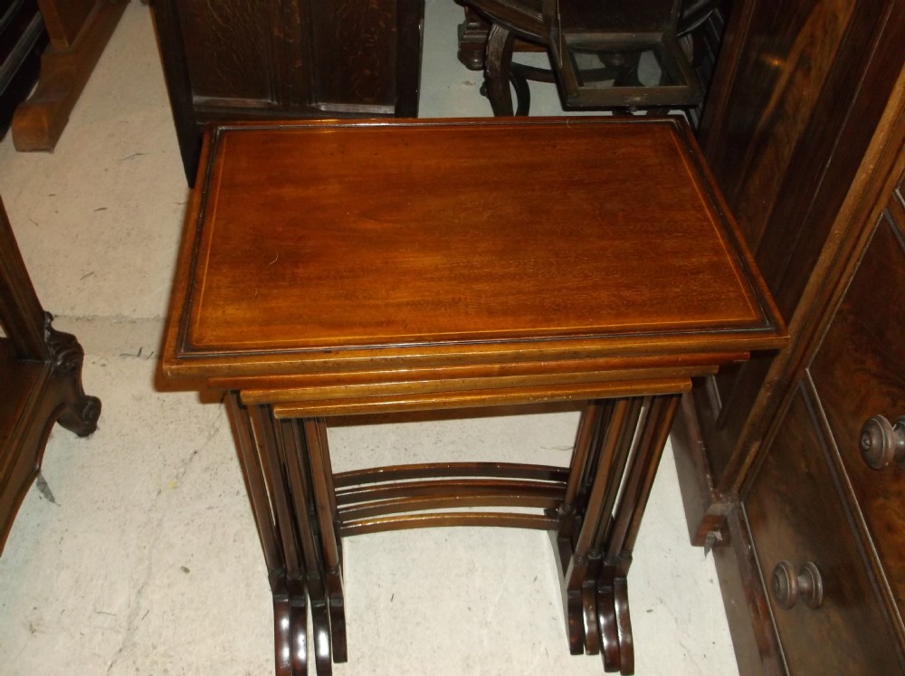 Nest of 4 inlaid mahogany tables