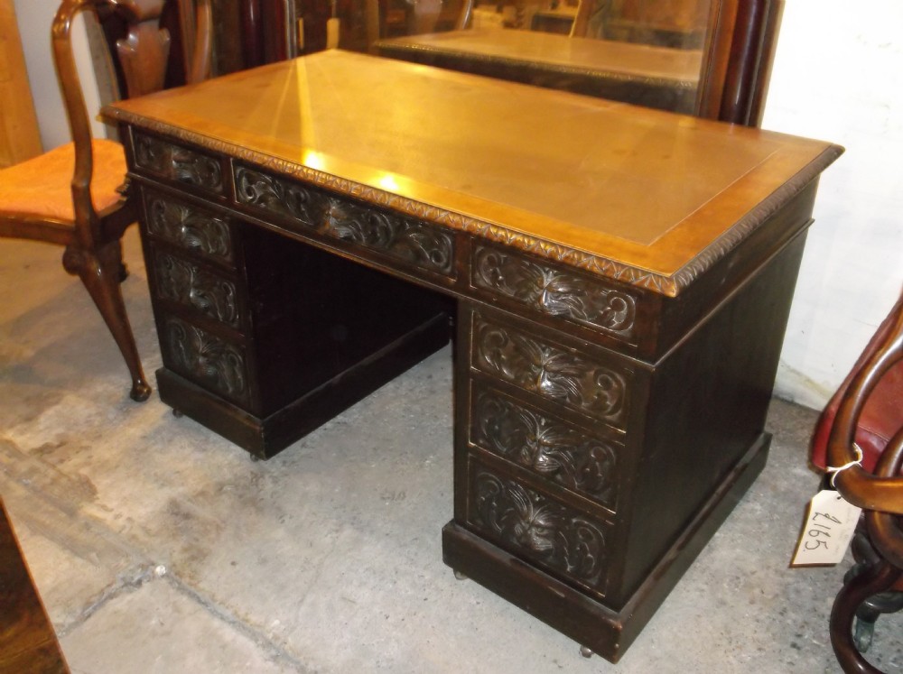 Late 19th century carved oak pedestal desk