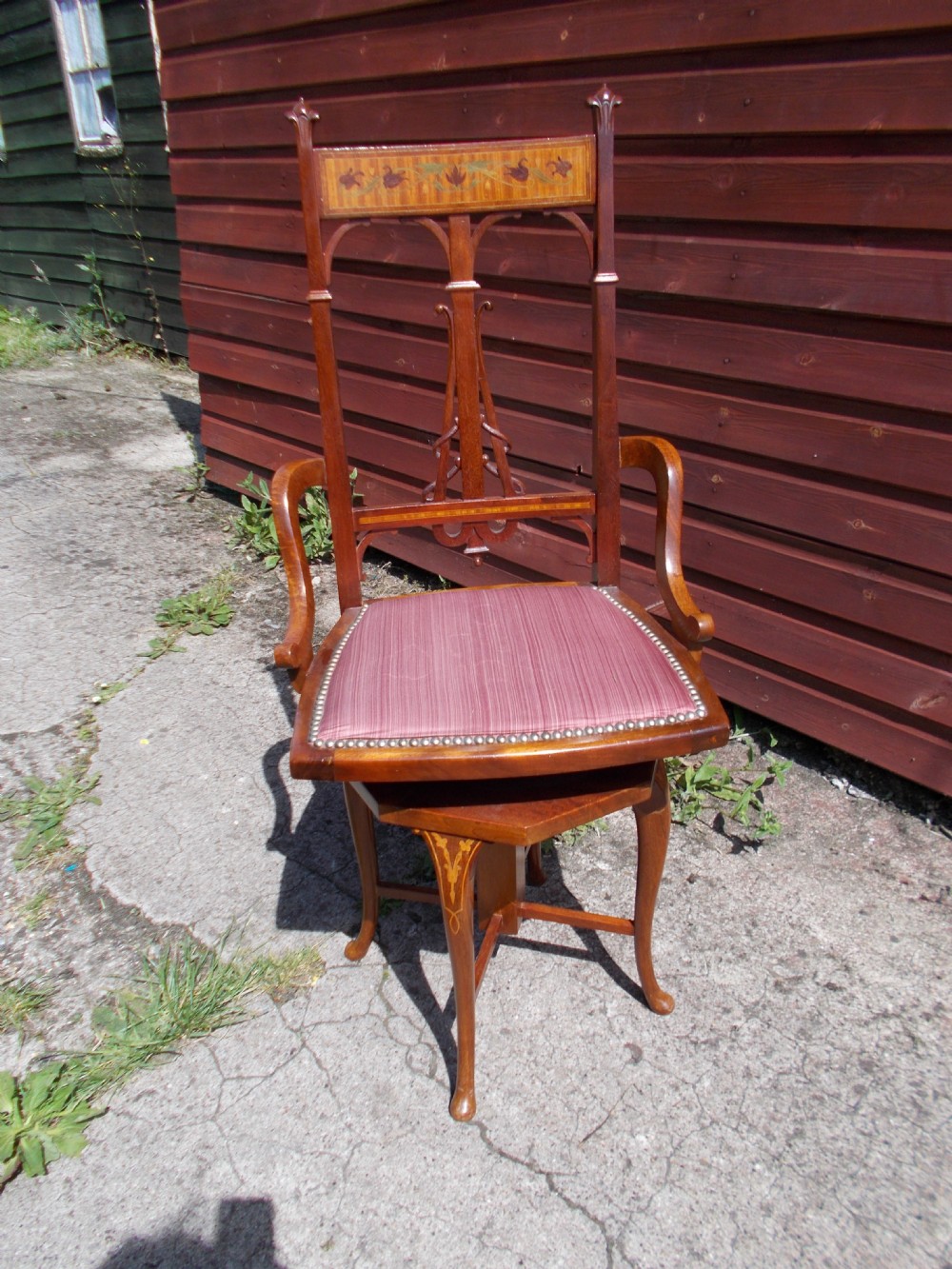 Inlaid mahogany revolving music chair