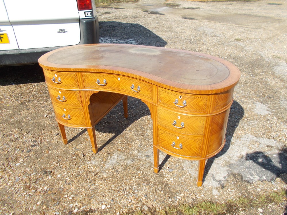 Early 20th century satinwood kidney shaped writing table