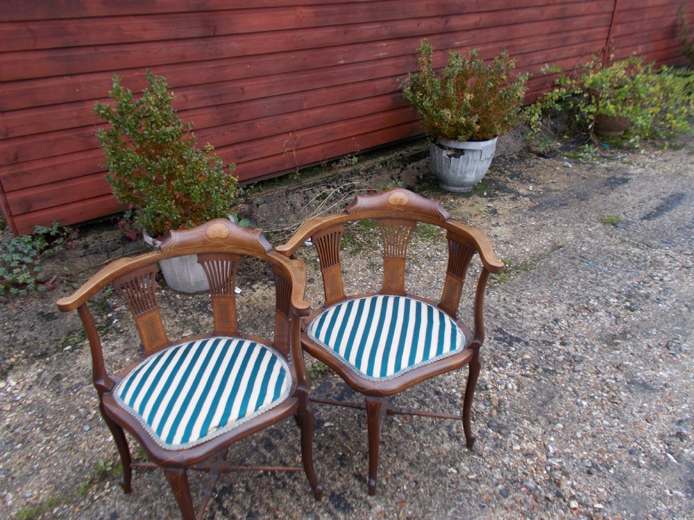Pair of Edwardian inlaid mahogany corner chairs.