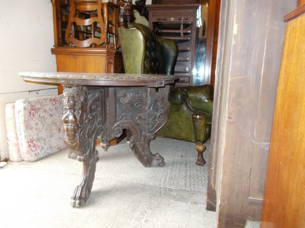 Interesting 19th century carved centre table.