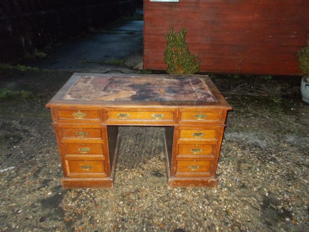 Edwardian oak kneehole pedestal desk