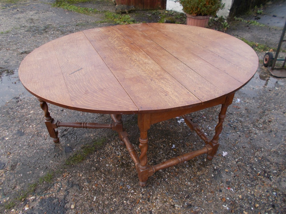Large early 20th century oak oval kitchen dining table.