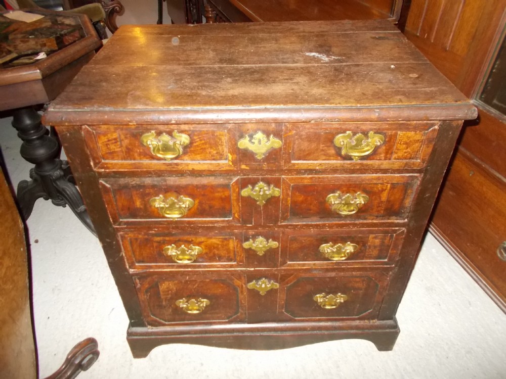 Small early 18th century oak and walnut chest. 