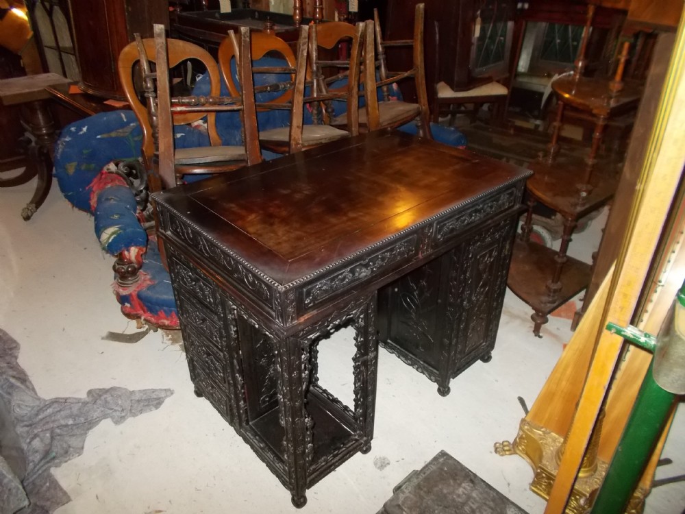 Carved Chinese kneehole writing table