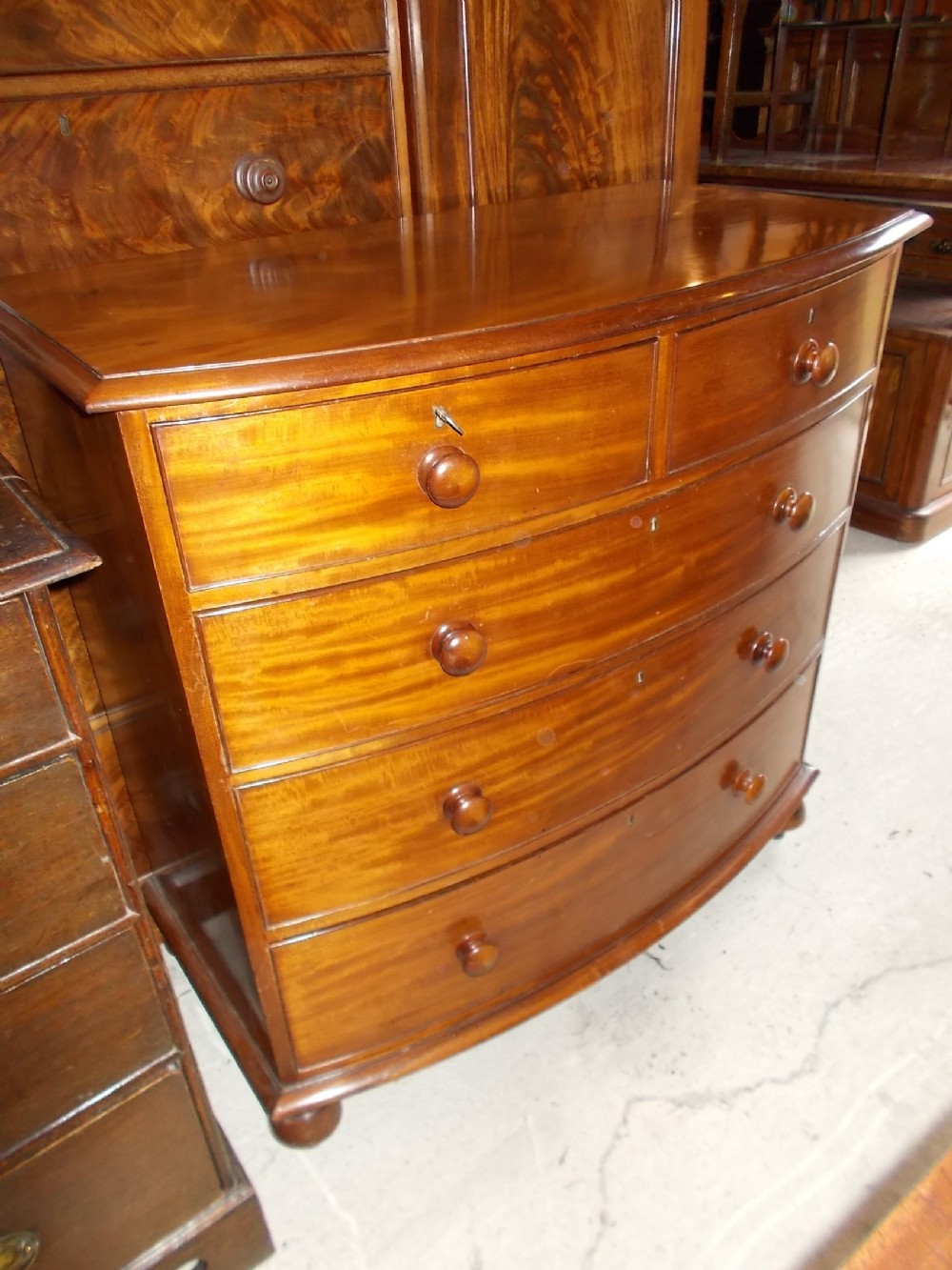 Early Victorian mahogany bow front chest of drawers