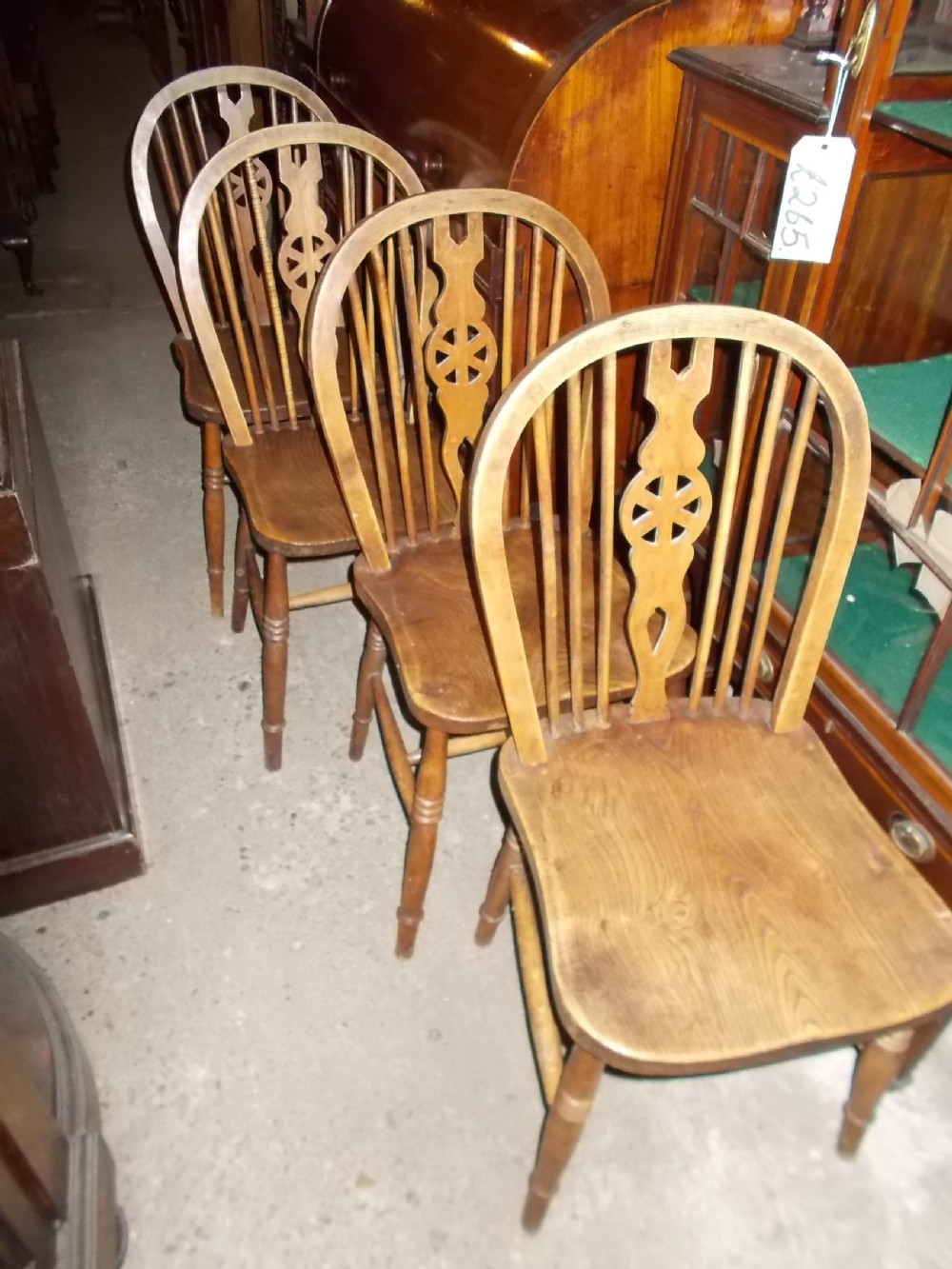 Set of 4 1920s windsor wheel back chairs.