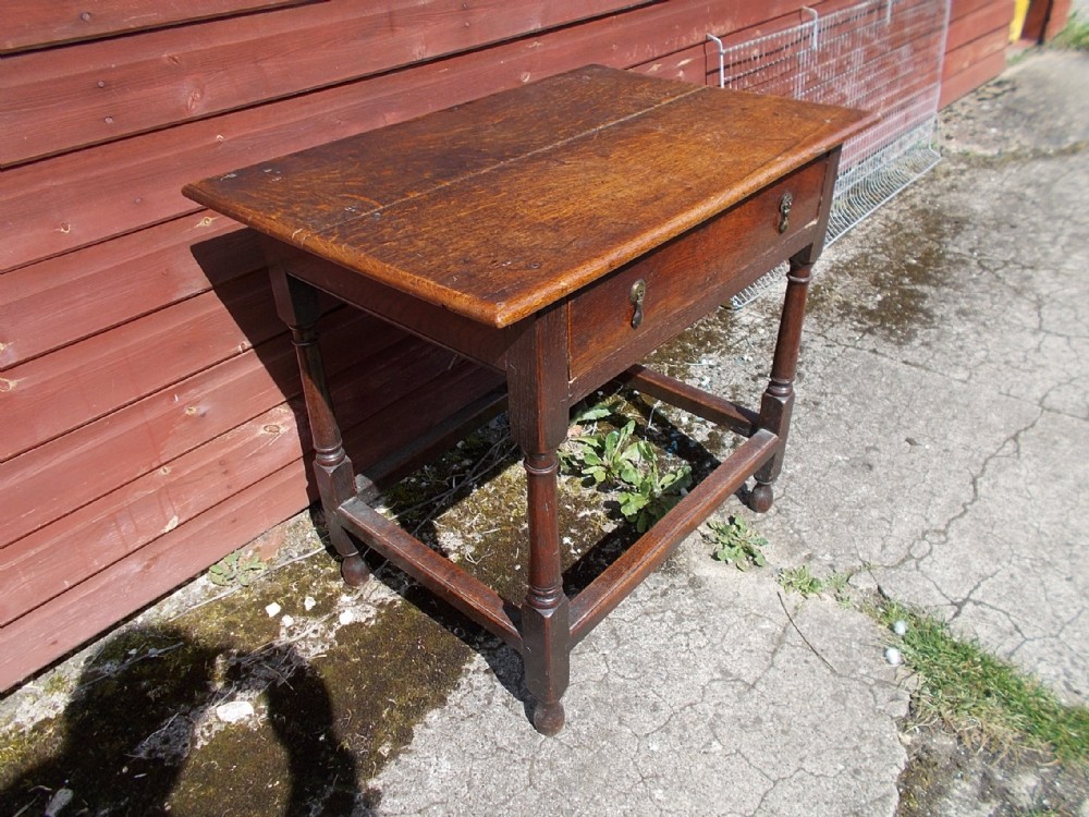 Late 18th century oak single drawer side table