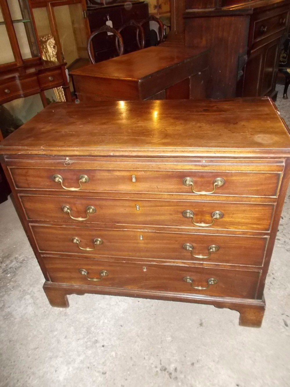 Late Georgian mahogany chest with slide