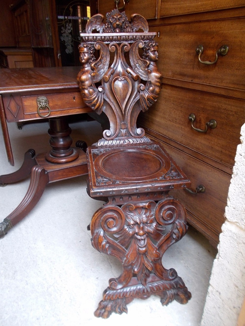 Late 19th century carved walnut hall chair