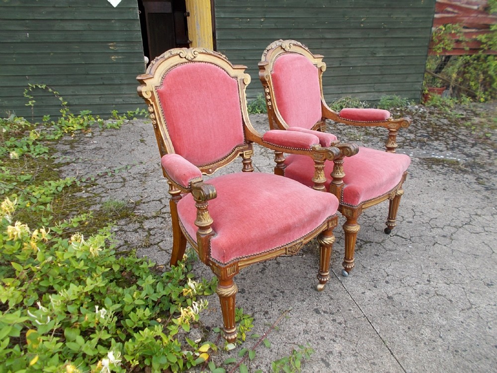 Impressive pair of oak and gilt heightened desk armchairs