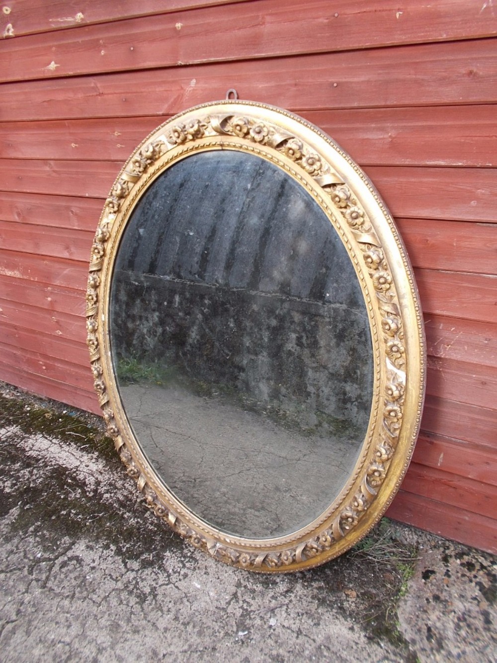 Large 19th century gilt gesso oval wall mirror