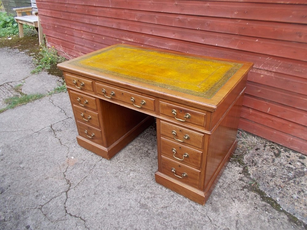 Early 20th century mahogany kneehole pedestal writing desk
