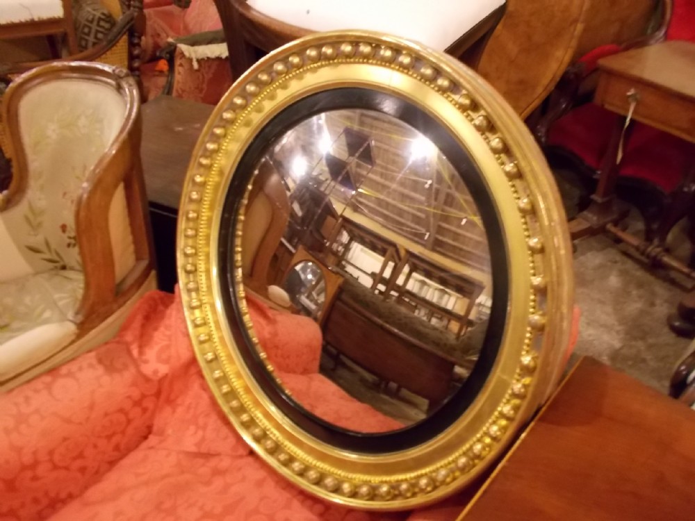 Good Regency gilded convex wall mirror