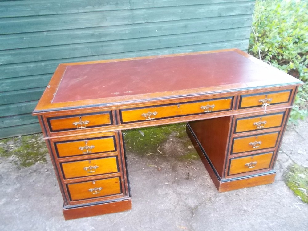 Late Victorian walnut and ebonised  pedestal desk