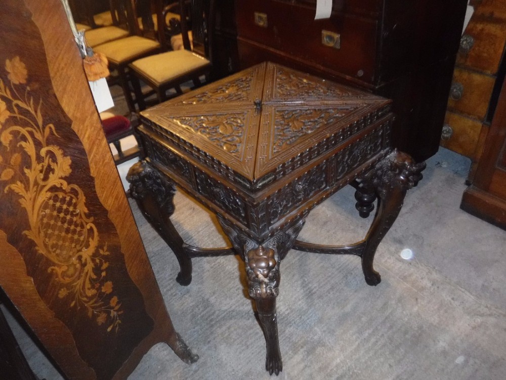 Early 20th century carved Oriental swivel top games table