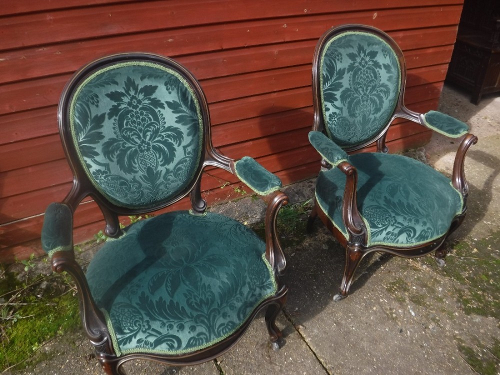 Pair of 19th century rosewood armchairs with applied brass work