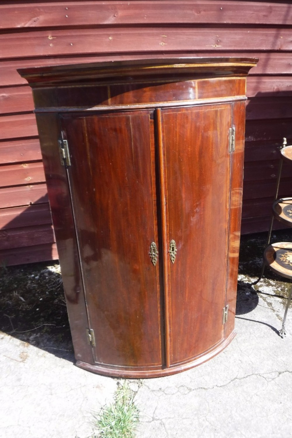 Early 19th century mahogany bow front corner  cupboard