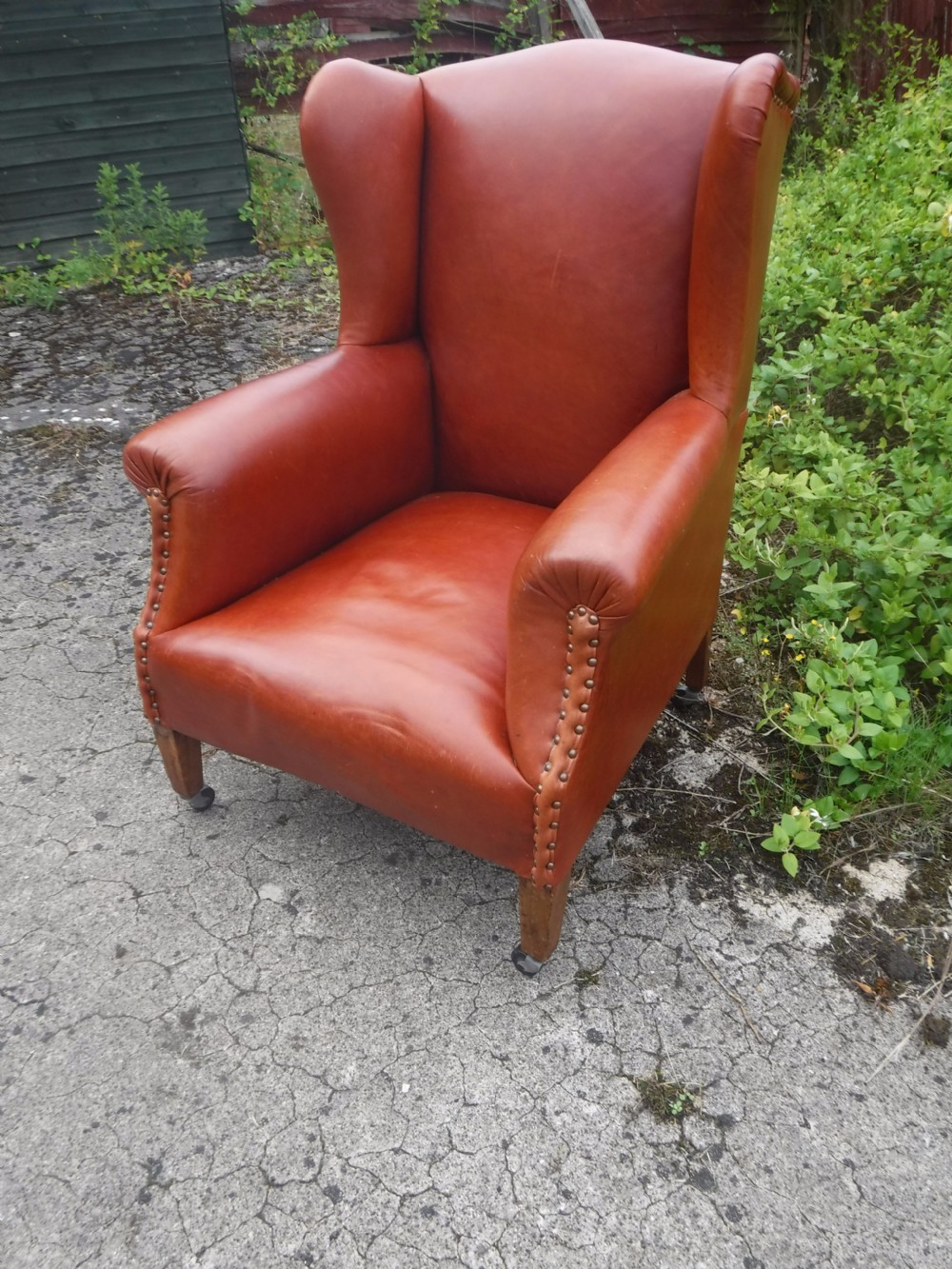 Early 20th century leather upholstered wing back armchair