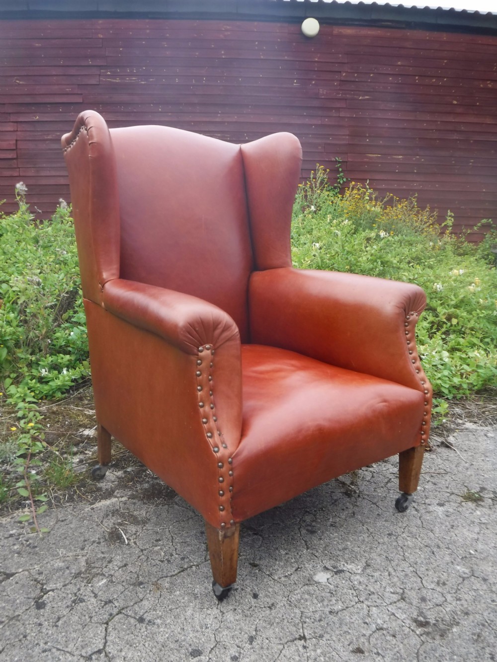Early 20th century leather upholstered wing back armchair View III