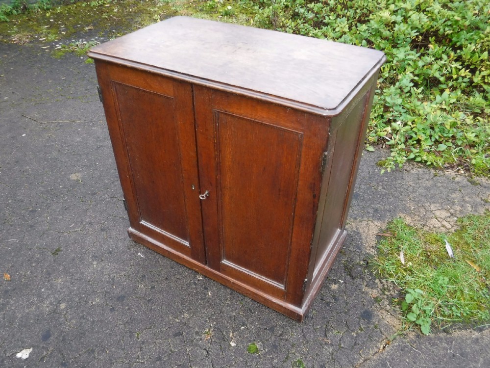Useful early Victorian country house oak  2 door  cupboard View V
