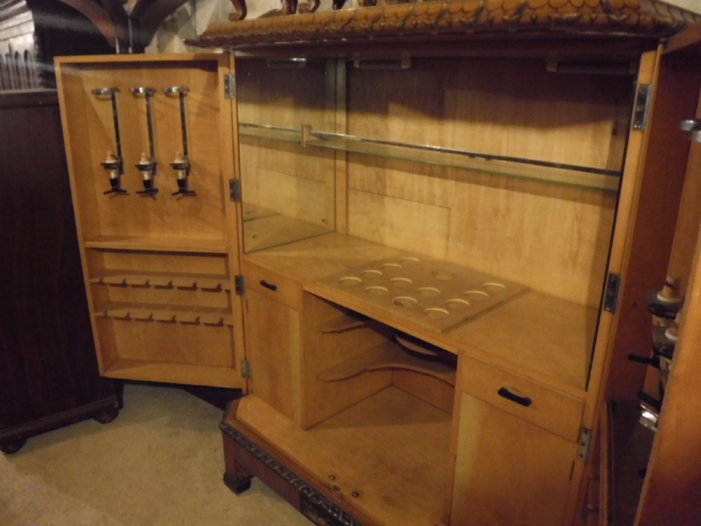 Large early 20th century satinwood cocktail cabinet,fitted interior. View VI