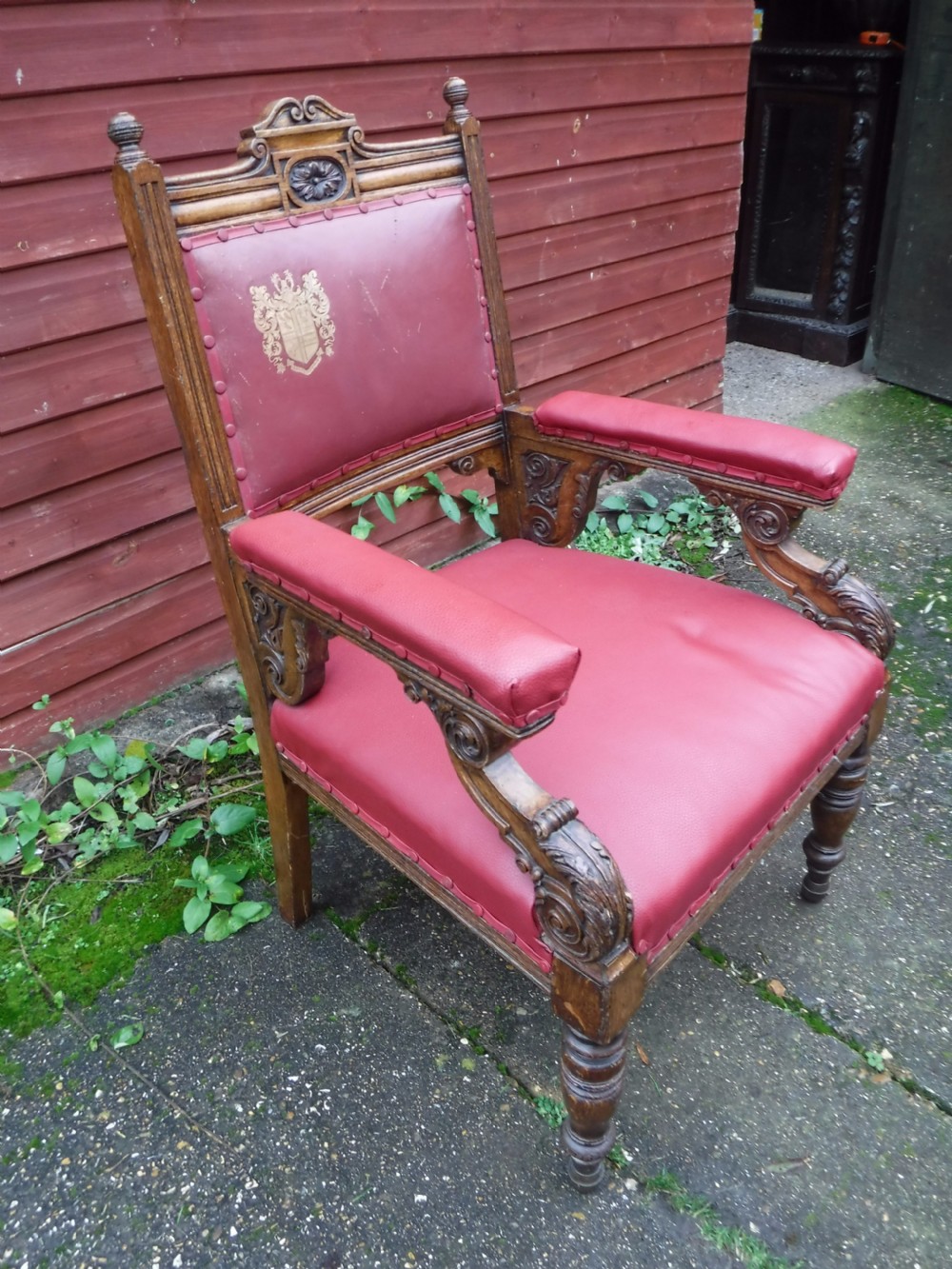 Large  oak frame  desk armchair with  coat of arms