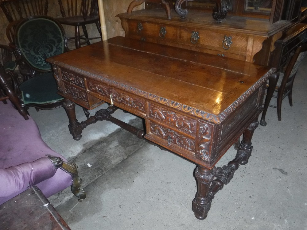 Late 19th century carved oak writing desk