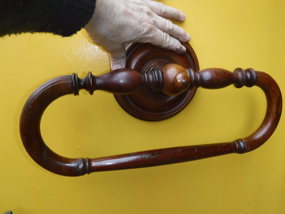 Late 19th century mahogany wall mounted towel rail.