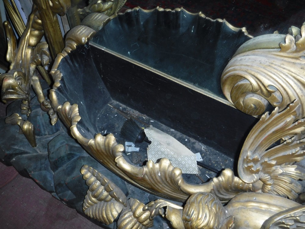 A tall giltwood hall mirror adorned with carved bamboo side pillars, mythical winged dragon motifs, and a carved shell base. View XIII