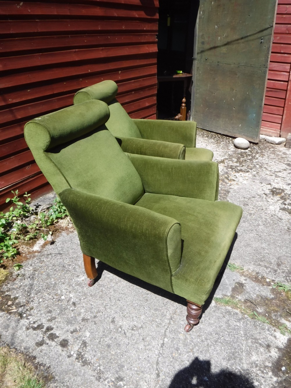 Pair of Late Victorian roll back upholstered armchairs View II