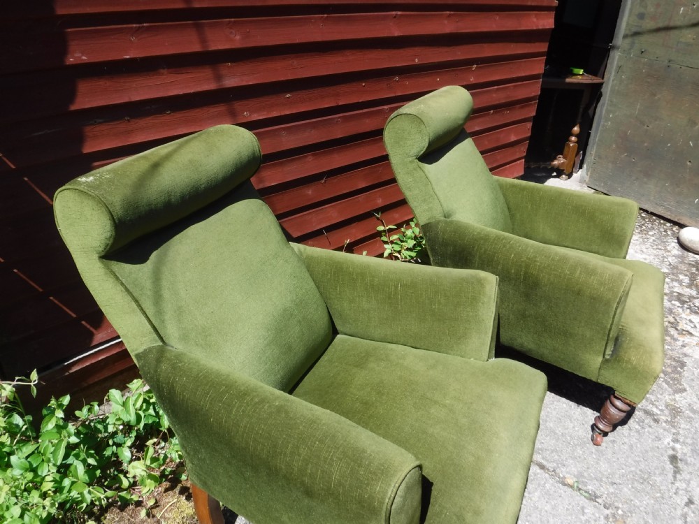 Pair of Late Victorian roll back upholstered armchairs View IV