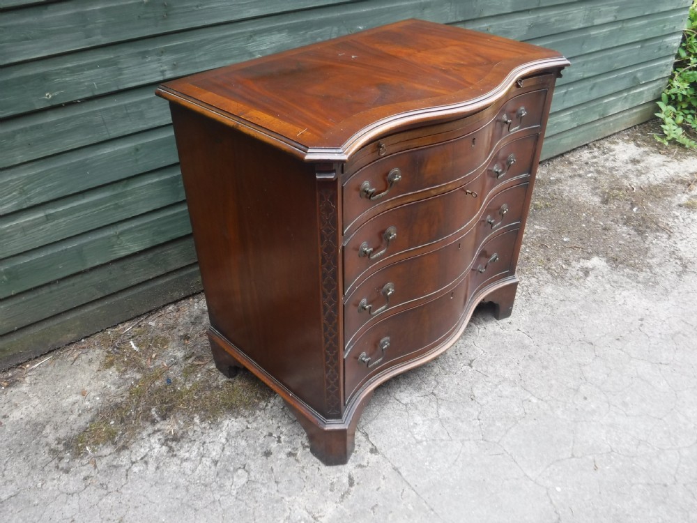Small early 20th century serpentine front mahogany chest View V