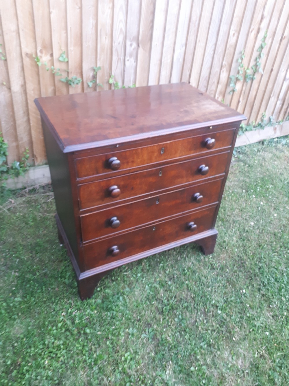 Small Georgian mahogany chest with slide View II