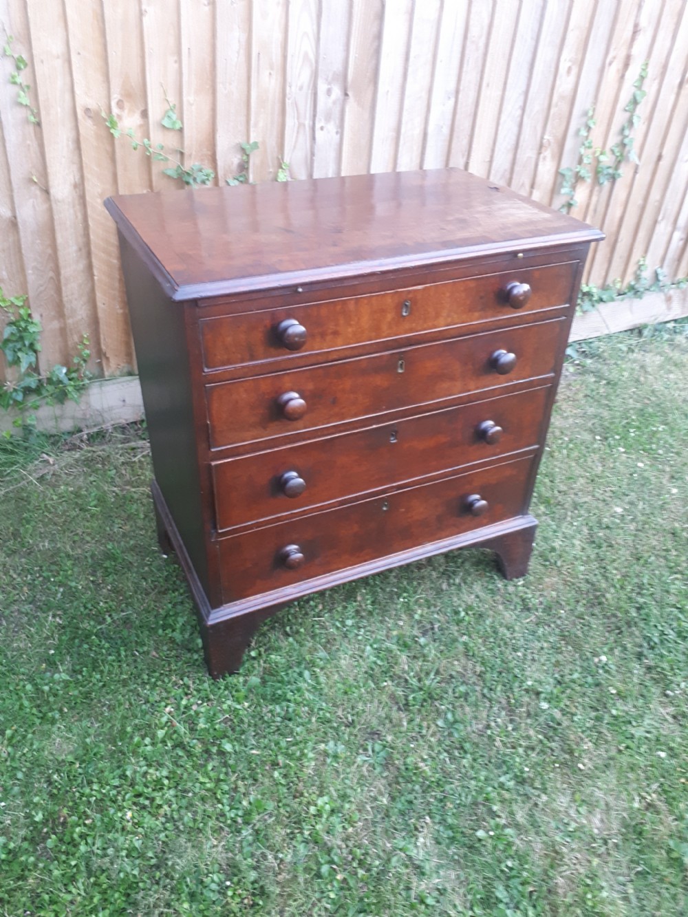 Small Georgian mahogany chest with slide View III