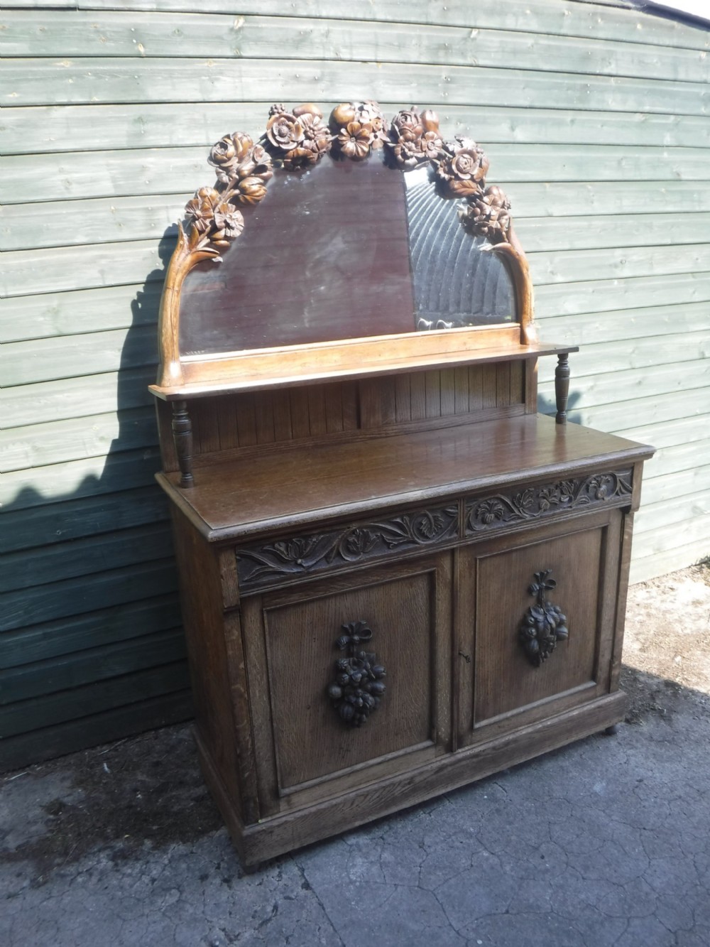 Lovely and unusual neat carved oak mirror backed side cabinet View VI