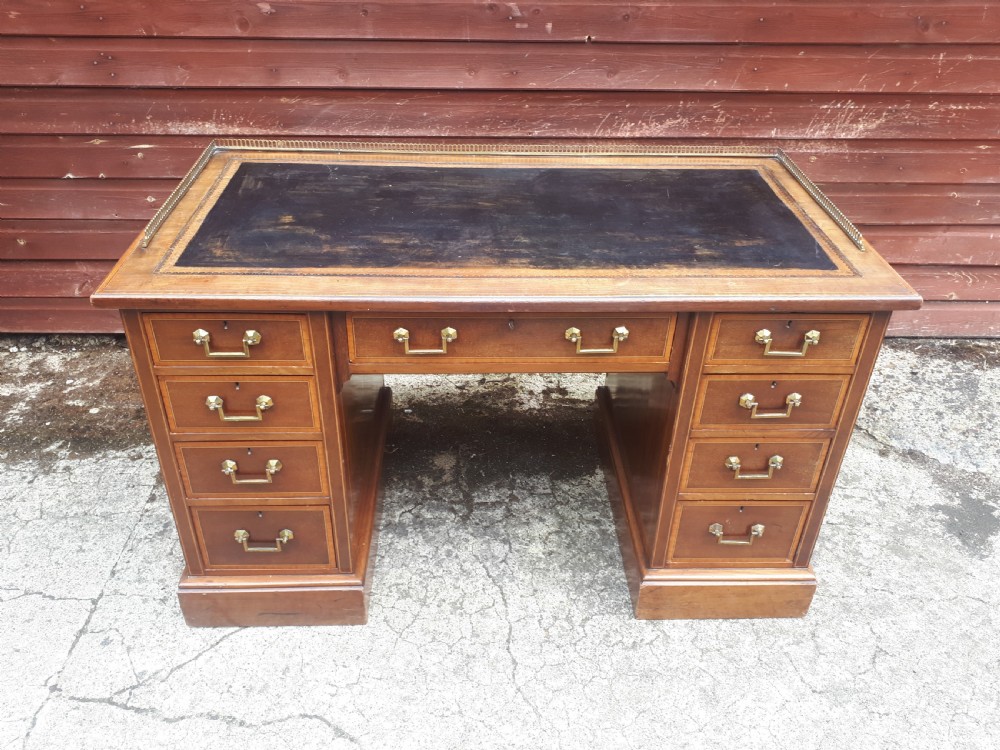 Edwardian inlaid mahogany kneehole desk