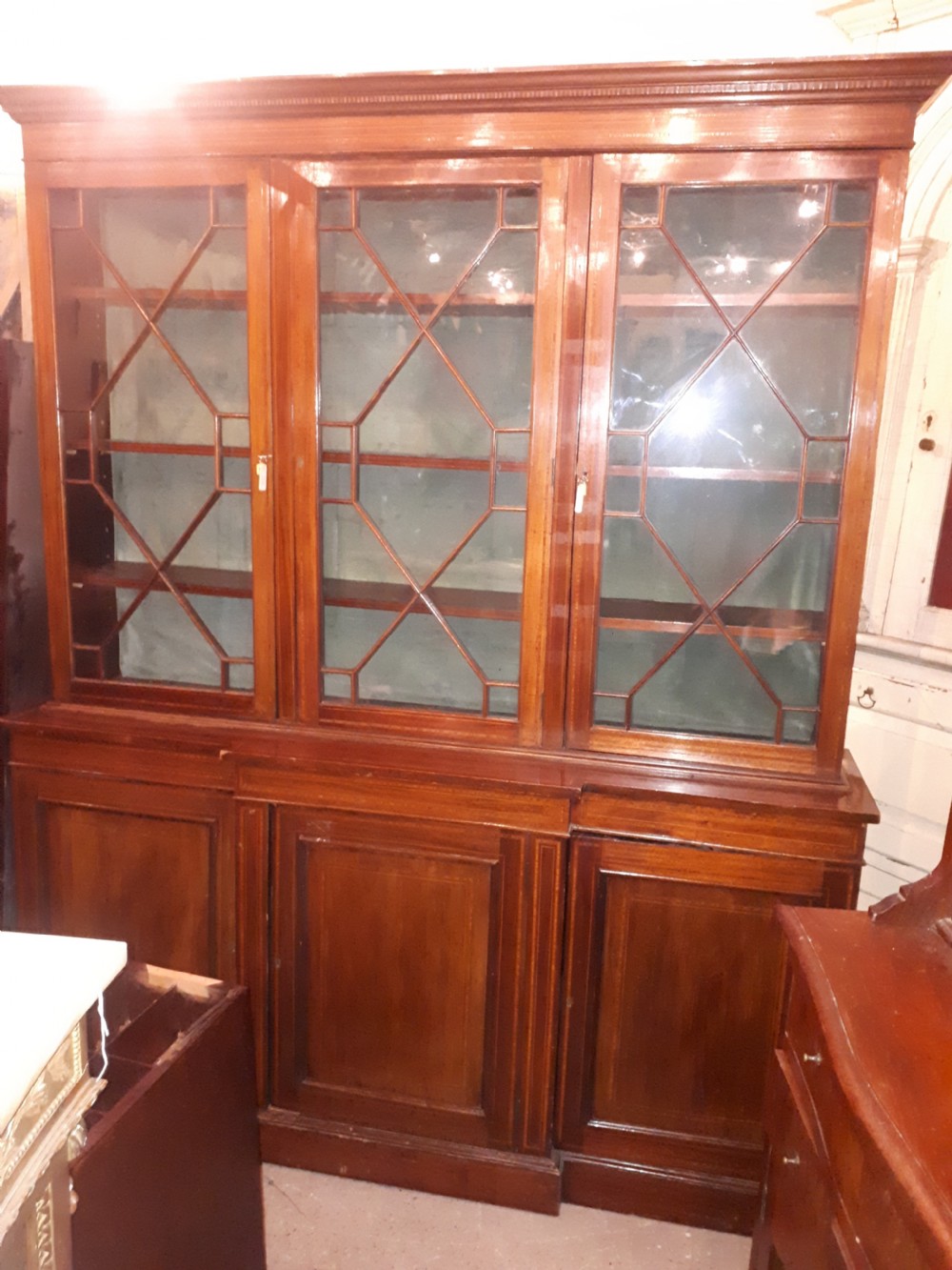 Edwardian inlaid mahogany breakfront bookcase.  View II