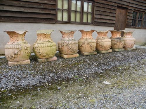 Seven Distressed 20th Century Large Garden Urns