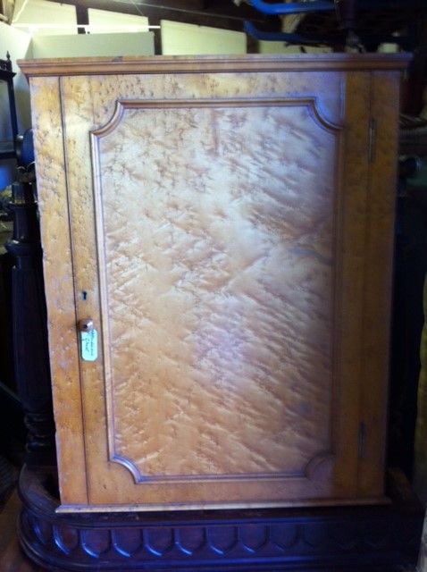 A Bird's Eye Maple Corner Cupboard