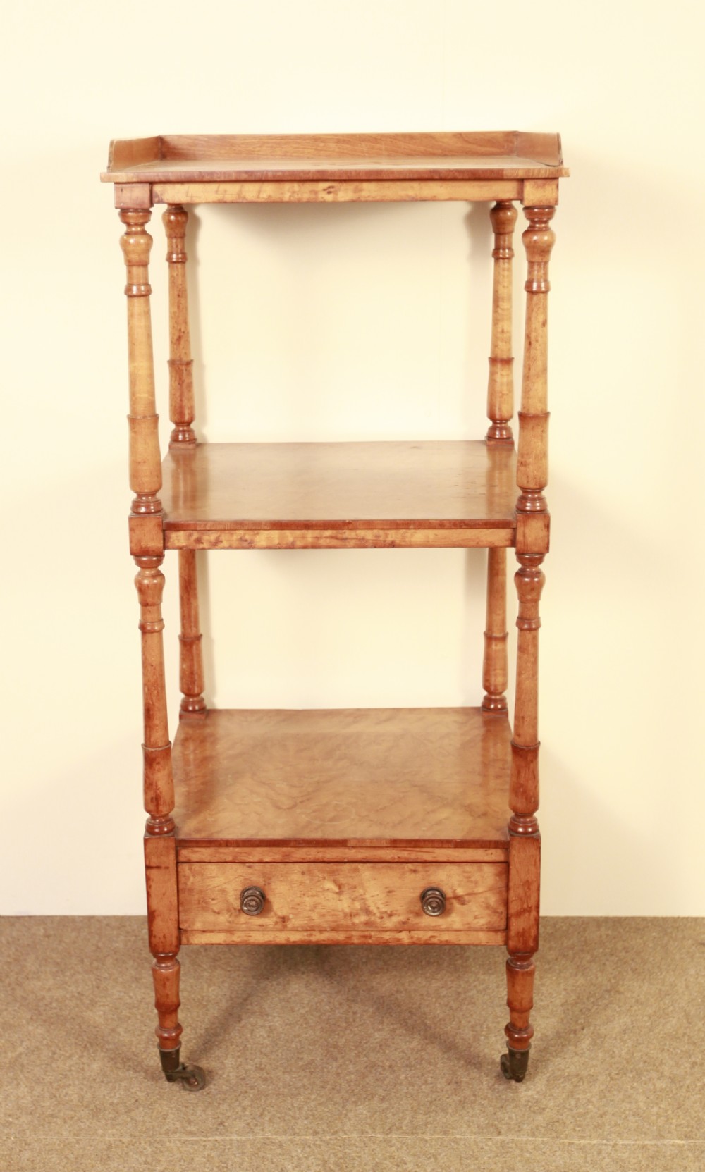 An early 19th century bird's-eye maple whatnot