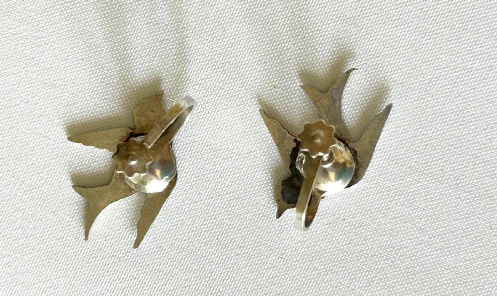 Pair of Edwardian sterling silver earrings shaped as swallows in flight with vibrant green enamel wings and body. View II