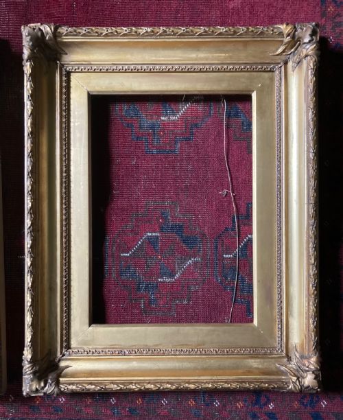 fig 1. A matching pair of rectangular antique gilt gesso picture frames featuring ornate corner carvings and leaf motif mouldings.