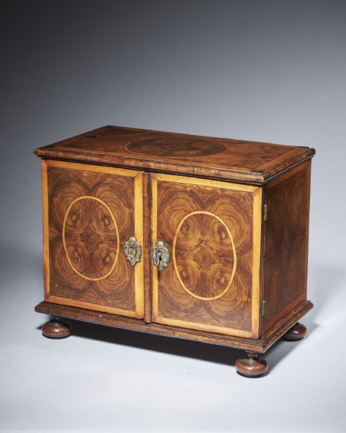 a rare and important late 17th century miniature table cabinet beautifully veneered in oysters of olive and banded in holly - CATEGORY: ANTIQUE CUPBOARDS - DATED 17TH CENTURY