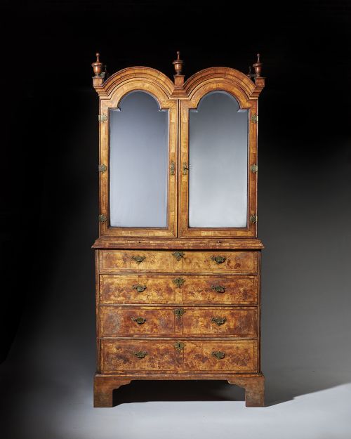 an original highly figured george i walnut double dome bookcase on chest circa 17201730 - CATEGORY: ANTIQUE BOOKCASES - DATED 18TH CENTURY