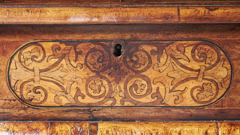 A rectangular seventeenth-century figured walnut box featuring intricate seaweed marquetry in an oval central cartouche and matching corner panels. View III